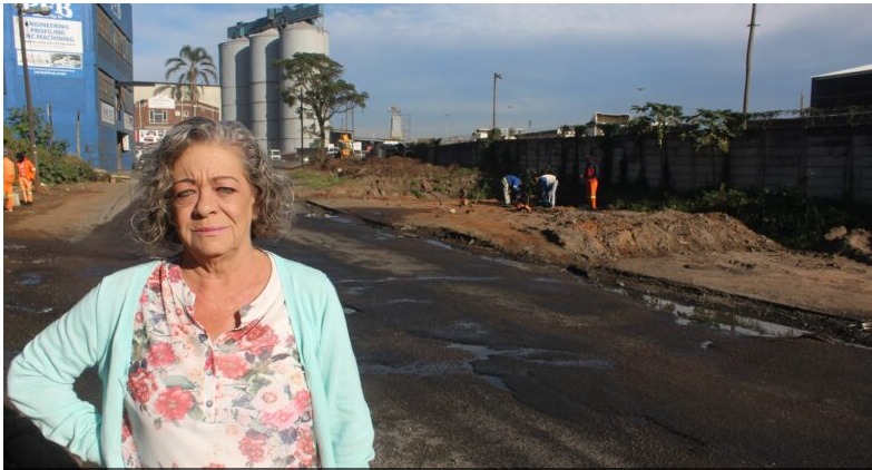Sharon Numan, the ward 66 committee chairperson for roads, transport and stormwater, stands in Bluff Road, were repairs are currently underway. 