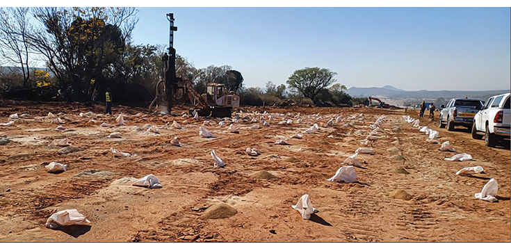 Careful preparation for blasting: Workers drilled precise holes into the rock outcrop, filling each to the required depth with explosives.