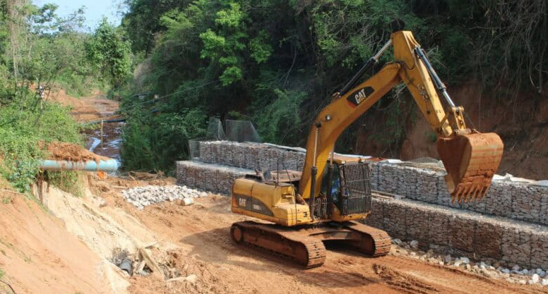 Workers have already installed a section of the gabion basket stormwater drain to secure the banks of the valley which the sewer pipe crosses. 