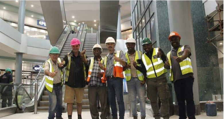 All excited for the opening of the Port Shepstone Mall today (Thursday) are part of the construction team (from left) Jimmy Vafeas, Dave Trotter, Vicky Kistasammy, Jorge Guilherme, Siyanda Sivuka, Thabani Mzileni and Sifiso Sihlangu.