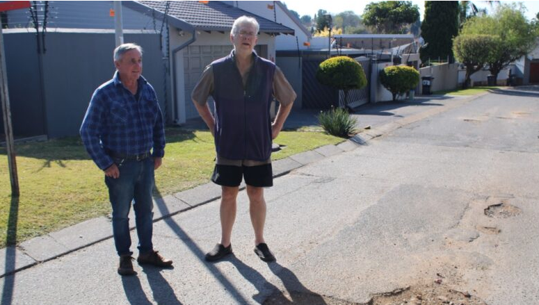 Brian Lewis and Raymond Lewis are concerned about the potholes on Patrys Road.