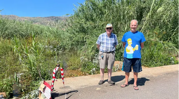 Gelhoutpark Residents Hans Meier and Sidney Verhoog near a damaged low-lying bridge on Pendoring Avenue, Rustenburg. 07 January 2026. 