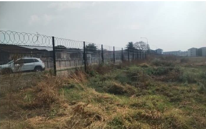 A section of the fence is open because the wire was stolen.