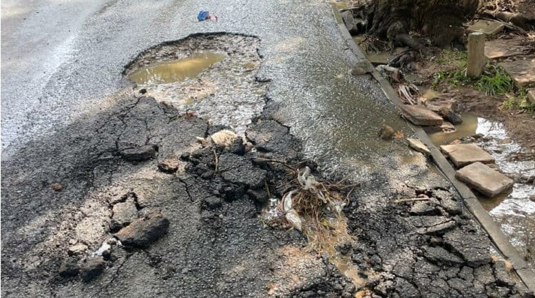  A large pothole on Randa Road caused by a continuous water flow. 