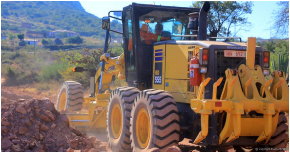 A grader photographed while busy fixing the D500 road.