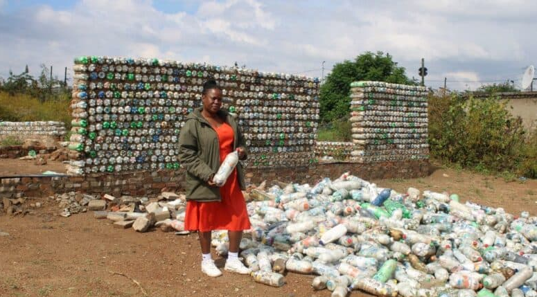  Mochaiki Mothapho, principal of Ark Academy, stands in front of their new ecobrick building school. 