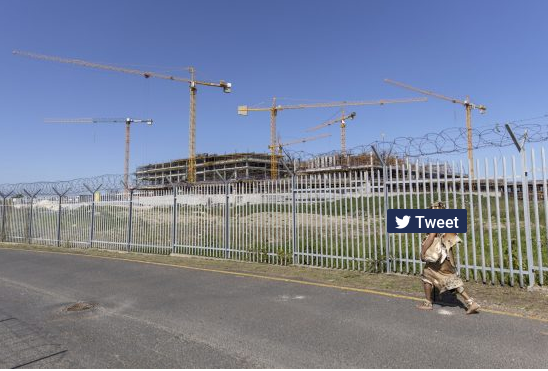Khoisan chief Bradley Van Sitters passes the Project Zola construction site in Cape Town, South Africa.