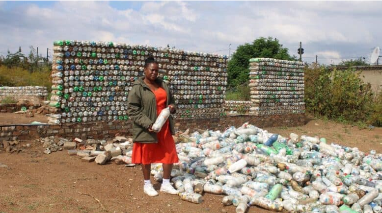  Mochaiki Mothapho, principal of Ark Academy, in front of their new ecobrick school.