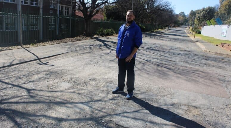 Ward 89 councillor Zander Shawe shows the state of the roads near Cliffview Pre-Primary School. 