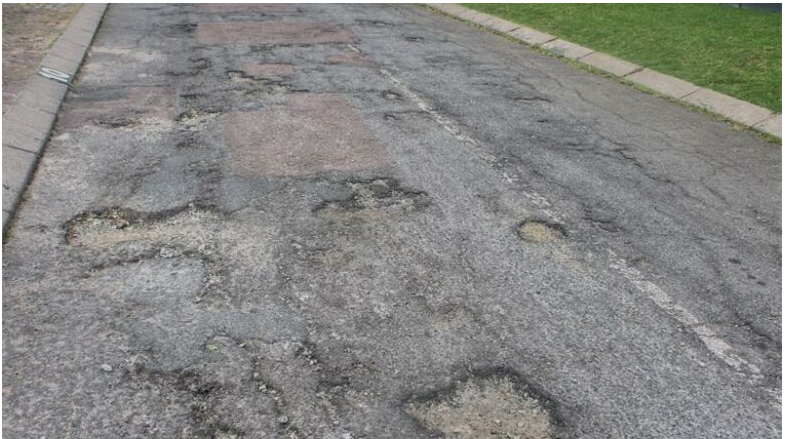 Potholes on 13th avenue in Fairland. 