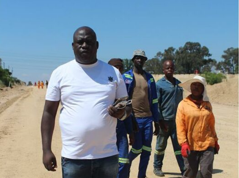 Ward 96 councillor Rufus Maswazi at the R511 road construction site during a walkabout with Region A officials.