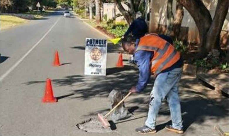 The Rotary Club fills up the potholes.