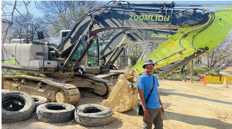 Resident Themba Ndlovu stands at the remaining construction in Duff Road.