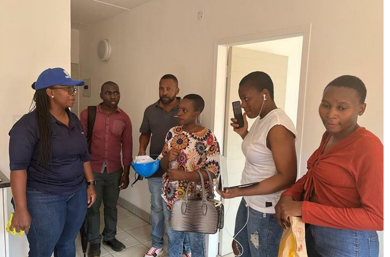 Beneficiaries viewing a unit.