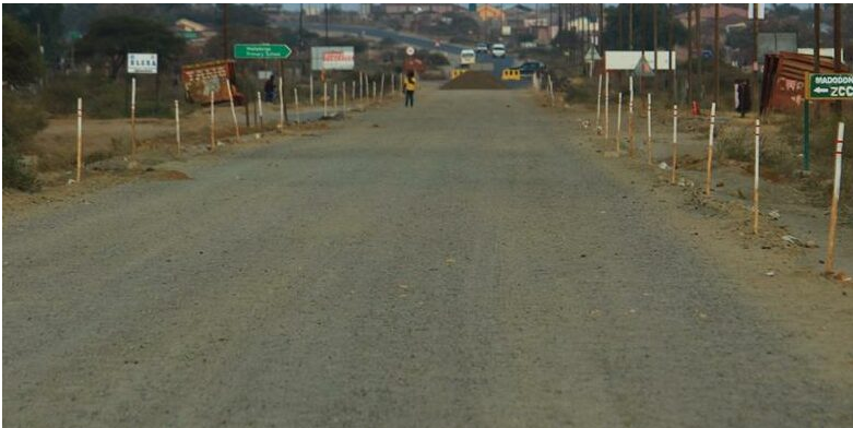 A contractor at work on the rehabilitation of the D3715 between Madodonga and Tshikhodobo.