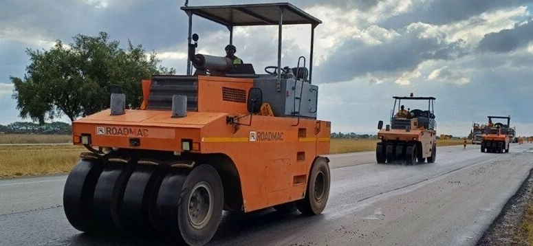 Road construction machines inching forward. Motorists are encouraged to plan ahead and travel cautiously during construction as lane closures and stop/go systems may cause delays. 