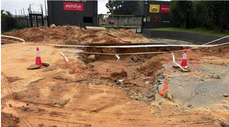 A large hole caused by a burst pipe continues to block access to businesses on 5th Street in Wynberg.