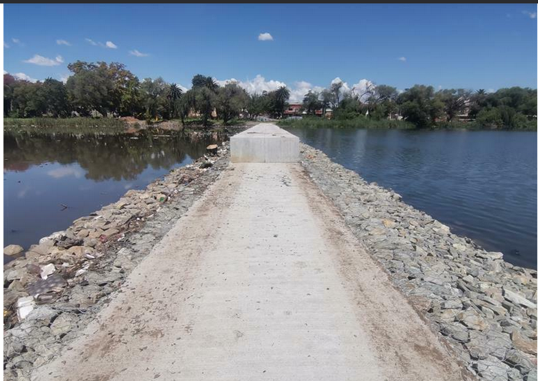 Workers are carrying out the remedial work on the weir.