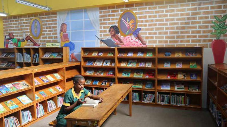 Lindelwa Nkwanyana spending quality time at the Malvern Library with it