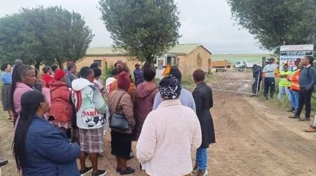 Eastern Cape public servants, mostly teachers, gathered outside the premises of a contractor in Ngqeleni, whose workers are government employees, to demand answers about delays in construction of a critical road. 