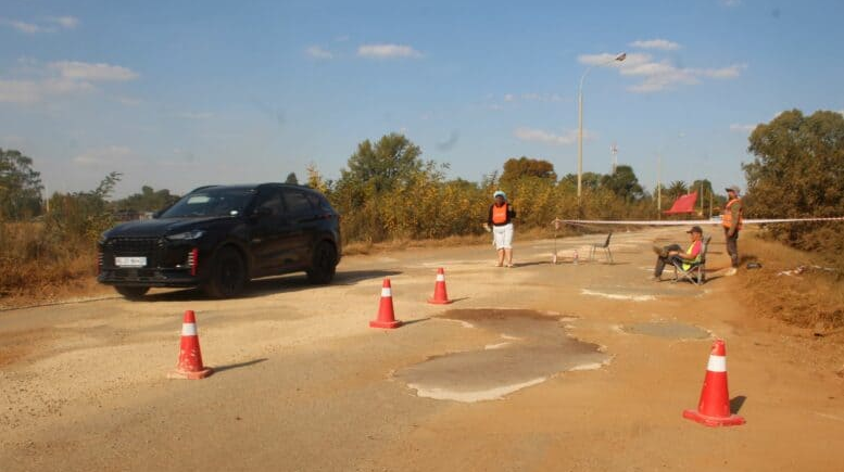  Welverdiend residents fixing potholes on the main route through the town. 