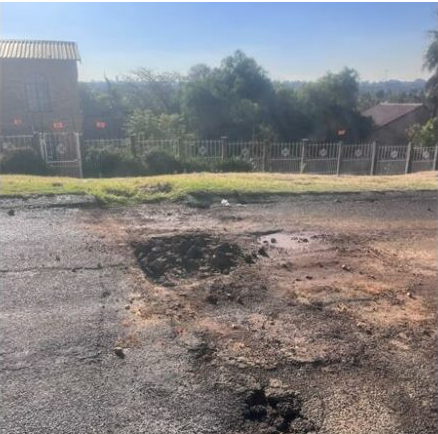 The damage to the road has not yet been fully addressed.