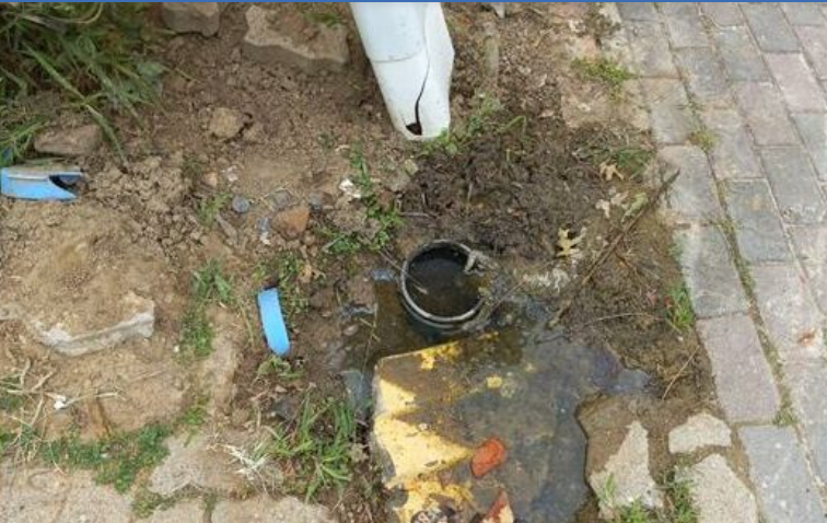 Another patch along Church Street where a water meter remains leaking after municipal water work, highlighting concerns over safety and the area’s visual decline.
