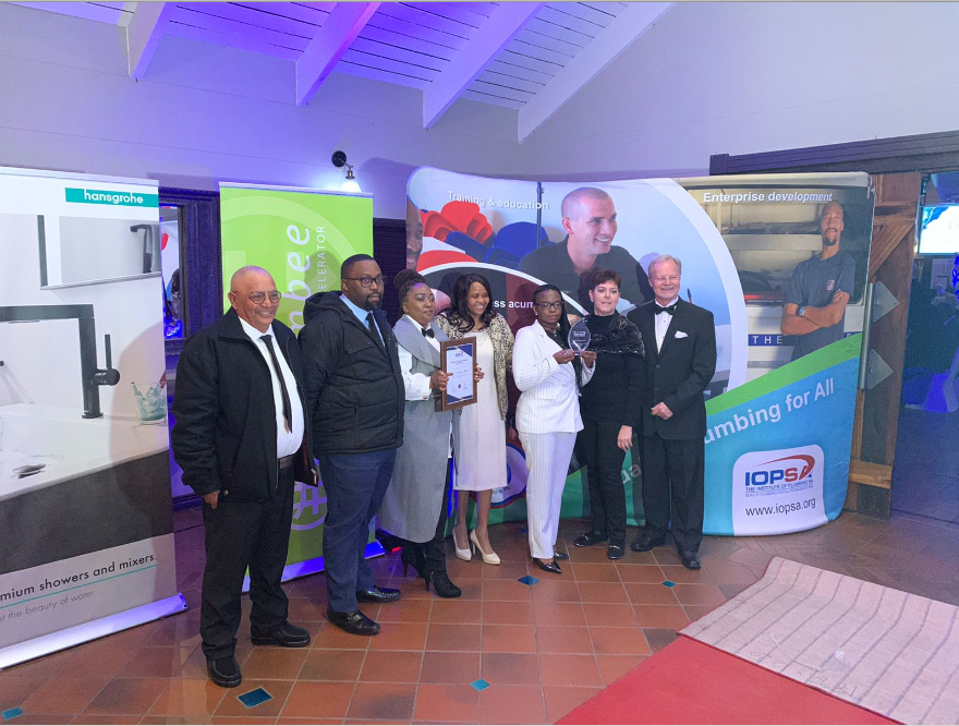 The Tjeka Training Matters’ team received the award from Nick Joubert, IOPSA’s National Training Manager.