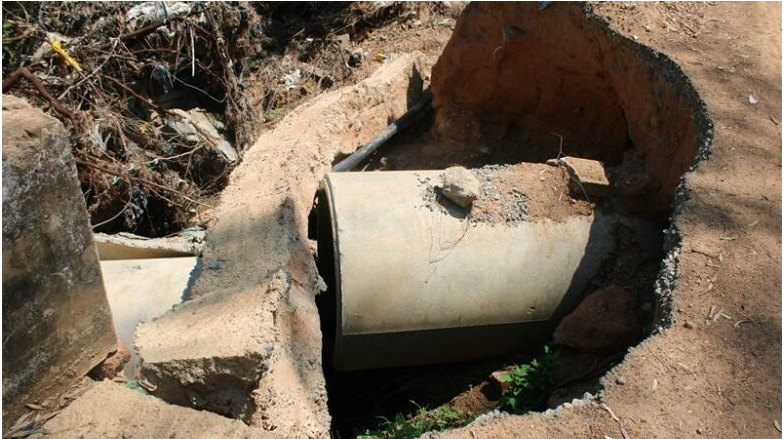 Part of the bridge collapsed on a stormwater pipe. 
