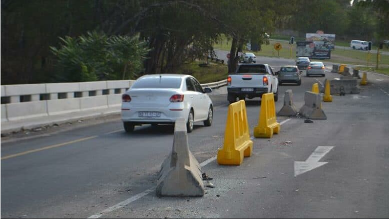  Motorists traversing the southern Modderfontein Road Bridge where an assortment of barricades can be seen narrowing the traffic flow. 