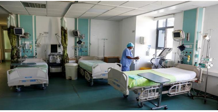 Hospital staff seen working in a ward.