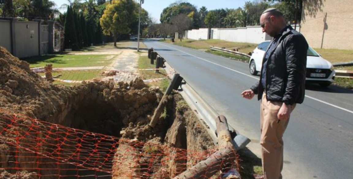  Ward 72 councillor David Schay observes an unattended excavation filled with water. 