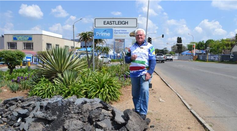  Ward 19 Clr, Ald Bill Rundle stands at the intersection of Plantation and Terrace roads, near a pile of tar. 