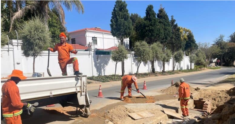 JRA employees carry out reinstatement work at the corner of Westway and Darter roads in Douglasdale following excavation linked to a Joburg Water pipe repair.