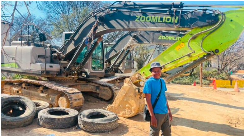  Resident Themba Ndlovu stands next to the construction site on Duff Road. 