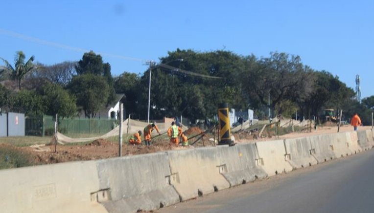  Workers on site on Garstfontein Road, where motorists have expressed concern about squatters. 