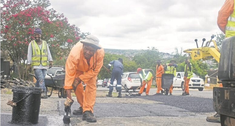 Msunduzi municipal contractors Umabovu Construction resurface the road at Balhambra Way in Newholmes on Monday. 