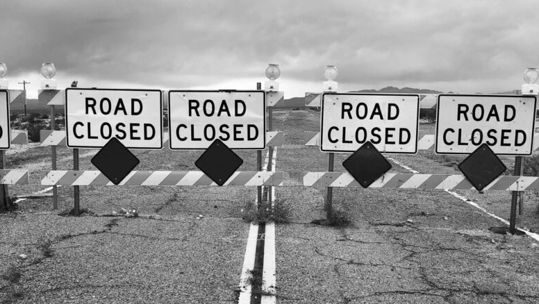  Photo by Joey Childs: https://www.pexels.com/photo/black-and-white-photo-of-road-with-road-closed-signs-4645138/ 