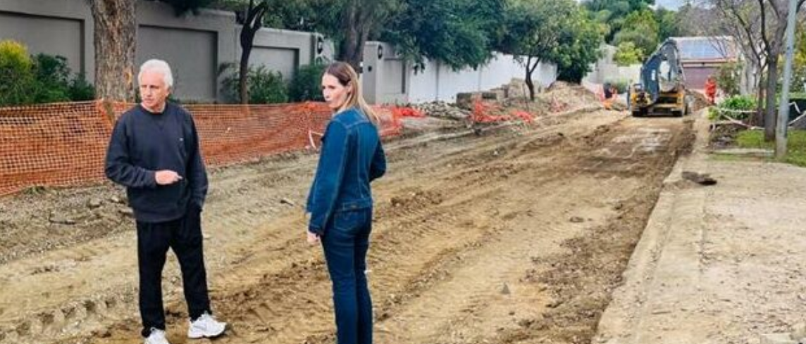 Ward 94 councillor David Foley and Charlene Marlin, Fourways Gardens Estate manager, on Chorisia Lane during its repairs in May. 